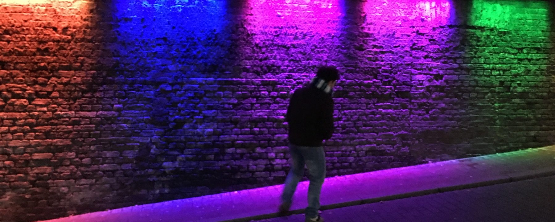 Background pic of Fab walking up Brighton railway station